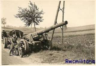    Wehrmacht Kradmelder on Motorcycle by Abandoned French Artillery