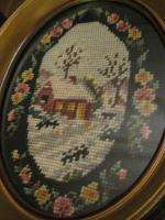 pair oval framed needlepoint pictures of houses with black border,deep 