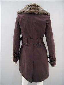 Double breasted trench coat has detachable faux fur collar, front flap 