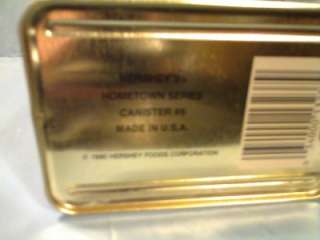 This VINTAGE 1990 TIN HERSHEYS HOMETOWN SERIES CANISTER #6 is in NEW 