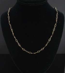   an elegant vintage estate onyx necklace set in solid 14k yellow gold